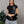 Babytee Bellakita CHILL negra cropped — algodón spandex con lettering script Bellakita en serigrafía gris claro, camiseta femenina streetwear hecha en Colombia