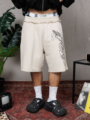Baggy Jort CHILL BEIGE unisex 300gr — algodón burda con estampado calligráfico gótico en pierna y efecto tela sobrante en pretina, streetwear hecho en Colombia