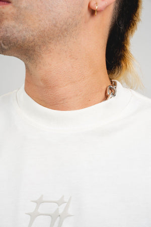 Camiseta Chill Spinas oversize blanca — algodón peruano 200gr con logo en relieve serigrafía tono sobre tono, streetwear minimalista hecho en Colombia