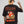 Camiseta Todo es un Parche CHILL oversize negra — algodón peruano 250gr con diablillo cartoon y lettering script en serigrafía naranja, streetwear hecho en Colombia
