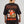 Camiseta Todo es un Parche CHILL oversize negra — algodón peruano 250gr con diablillo cartoon y lettering script en serigrafía naranja, streetwear hecho en Colombia