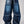 Jeans baggy CHILL azul washed — denim con bordes deshilachados curvos y bordado tribal, streetwear hecho en Colombia