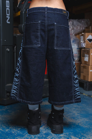 Jorts CHILL azul raw denim — bermuda baggy con estampado tribal serigrafía, streetwear hecho en Colombia