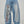 Spider Lily Jean CHILL celeste barrel — denim 100% algodón unisex con estampado floral tribal en pierna y bordado en bolsillos traseros, streetwear hecho en Colombia