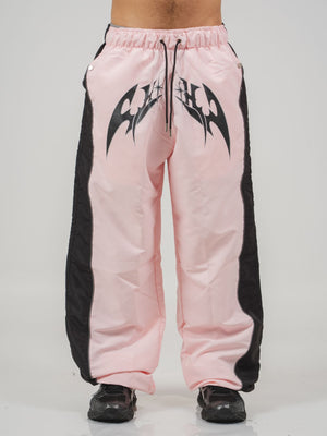 Parachute Track CHILL rosa — pantalón baggy antifluido con estampado tribal, streetwear colombiano