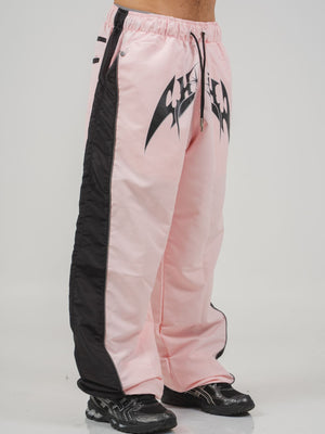 Parachute Track CHILL rosa — pantalón baggy antifluido con estampado tribal, streetwear colombiano