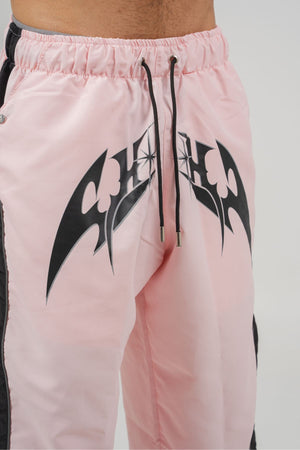 Parachute Track CHILL rosa — pantalón baggy antifluido con estampado tribal, streetwear colombiano