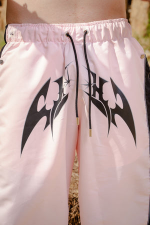 Parachute Track CHILL rosa — pantalón baggy antifluido con estampado tribal, streetwear colombiano