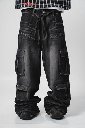 Twisted Cargo Jean CHILL negro washed baggy — denim con bolsillos cargo dobles y costuras blancas contraste, streetwear hecho en Colombia